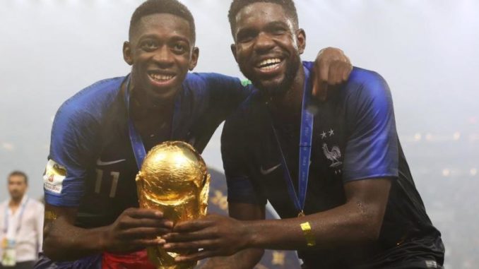 Ousmane-Dembele-and-Umtiti-of-France-with-World-Cup-trophy