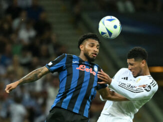 Atalanta's Brazilian midfielder #13 Ederson (L) and Real Madrid's English midfielder #5 Jude Bellingham vie for the ball during the UEFA Super Cup football match between Real Madrid and Atalanta BC in Warsaw, on August 14, 2024. (Photo by Sergei GAPON / AFP)