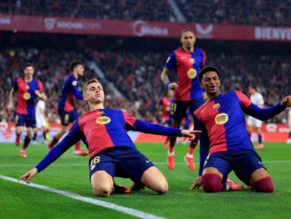 SEVILLE, SPAIN - FEBRUARY 09: Fermin Lopez of FC Barcelona celebrates scoring his team's second goal with teammate Alejandro Balde during the LaLiga match between Sevilla FC and FC Barcelona at Estadio Ramon Sanchez Pizjuan on February 09, 2025 in Seville, Spain. (Photo by Fran Santiago/Getty Images)